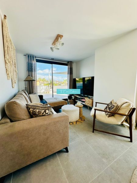 Living room in a 3-room apartment with stylish furnishings and a large window.