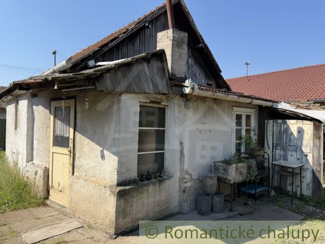 Older family house in Šurany, with a simple facade and wooden details.