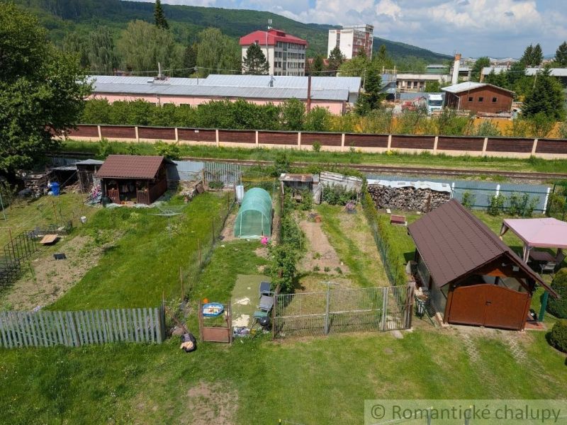 A garden in Medzilaborce with garden shelters and a raised bed according to the season.