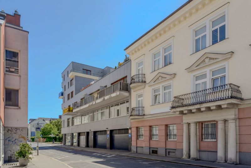 Buildings on Dunajská Street in Bratislava with historical facades and balconies.