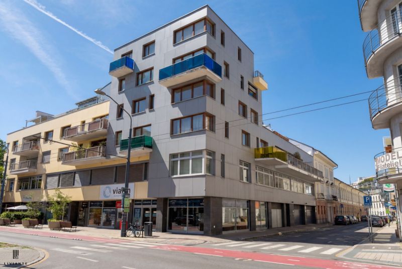 An apartment building on Dunajská Street in Bratislava offering 4-room apartments with balconies.
