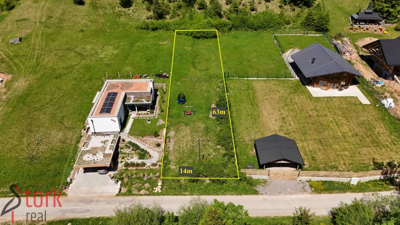 Residential plots in Rajecká Lesná with dimensions of 63 m x 14 m, surrounded by houses.