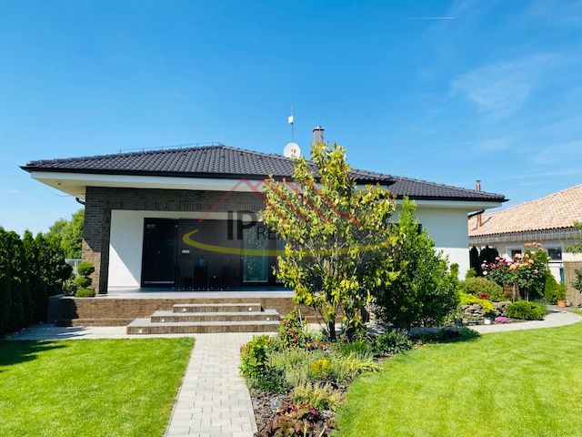 A family house on Jasná Street in Veľké Dvorníky with a landscaped garden and terrace.
