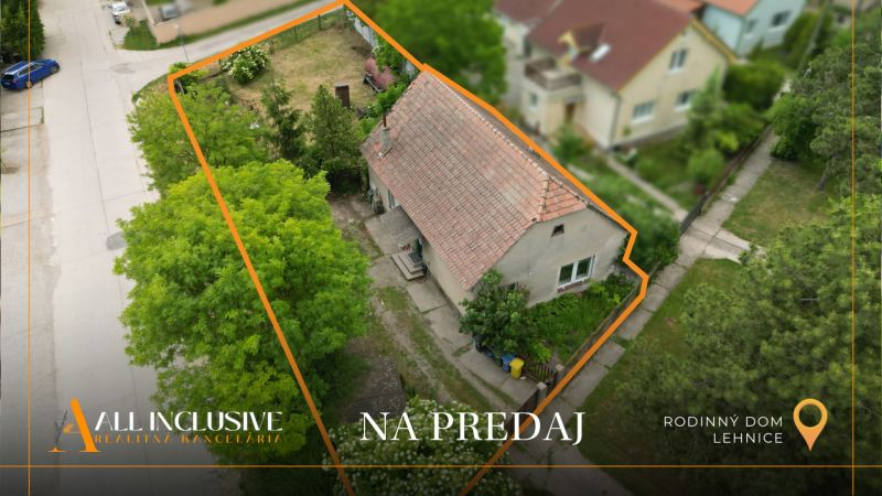 Family house in Lehnice with a plot bordered by greenery for sale.