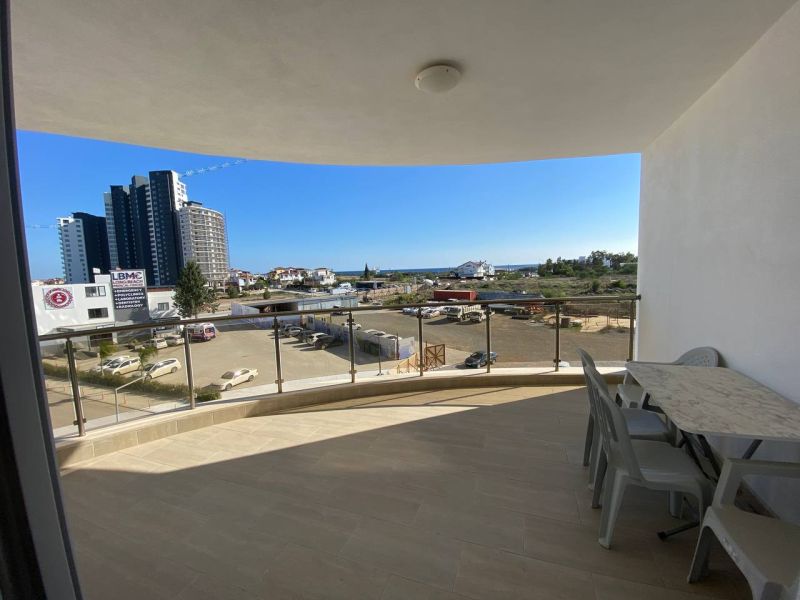 Balcony of a 3-room apartment in Iskele with a view of the sea and the city.