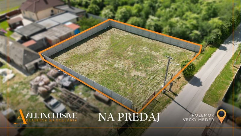 A residential plot in Veľký Meder, Ižop area, fenced and ready for construction.