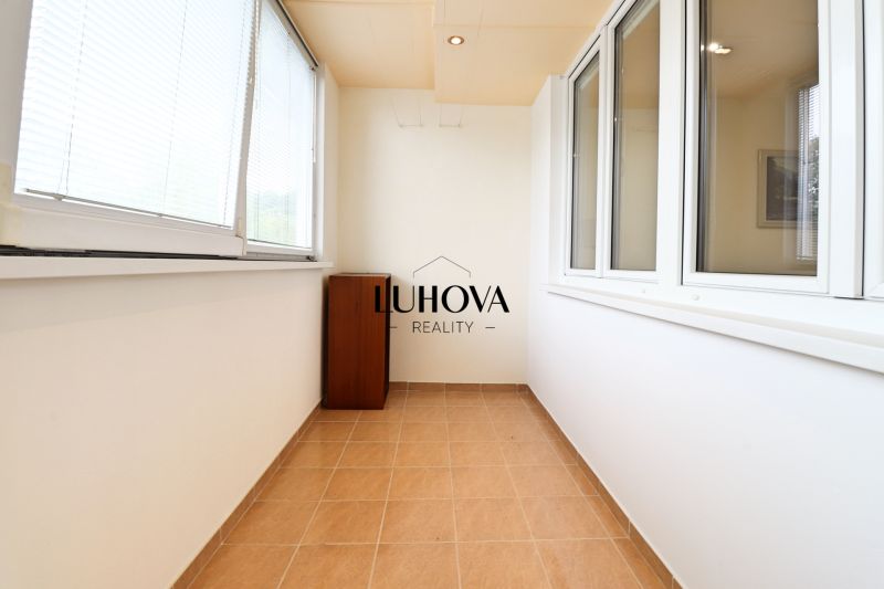 Glazed loggia with ceramic flooring in a 3-room apartment.