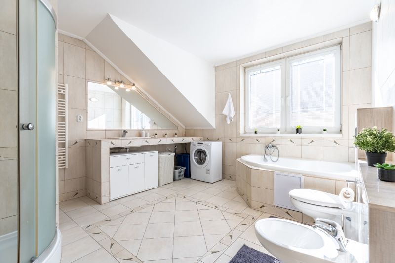 A spacious bathroom with a bathtub, shower, and washing machine in a 3-room apartment.