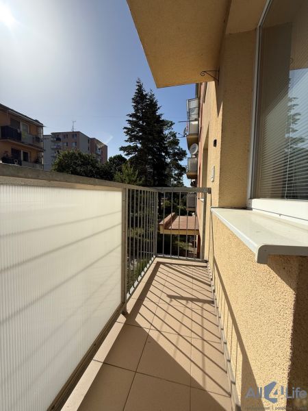 The balcony of a 3-room apartment on the 9th of May Housing Estate in Vrbové, view of greenery.