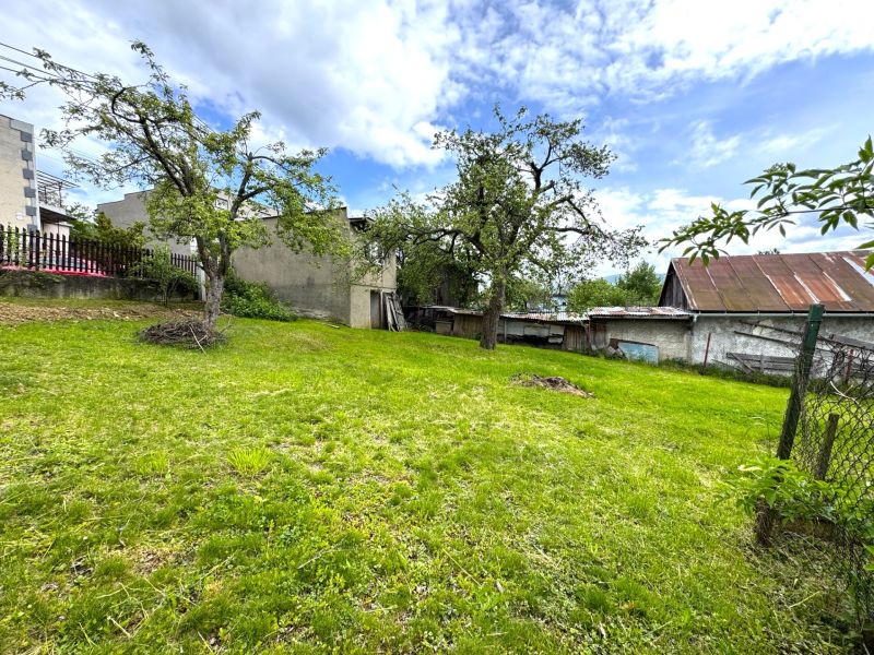 Plots - housing in Lipany with fruit trees on a manicured lawn.