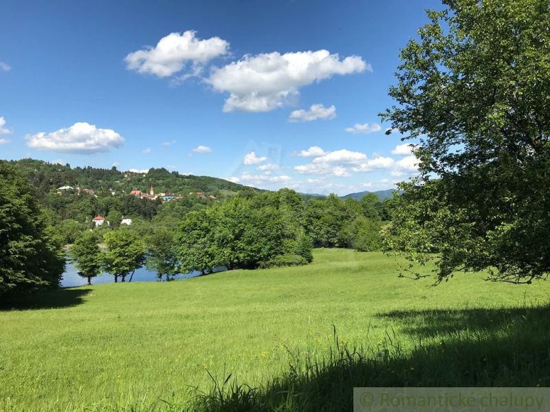 Beautiful natural scenery around Štiavnické Bane with a view of family houses.