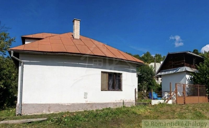 A family house in Štiavnické Bane with a gable roof and a garden.