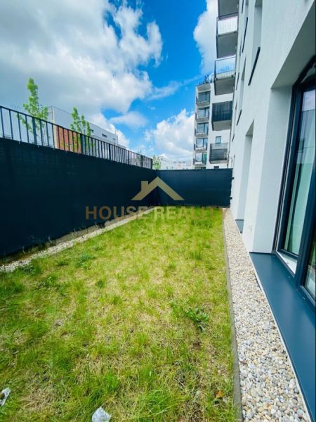 A small grassy outdoor area next to a 2-room apartment on Agátová Street, Bratislava - Dúbravka.