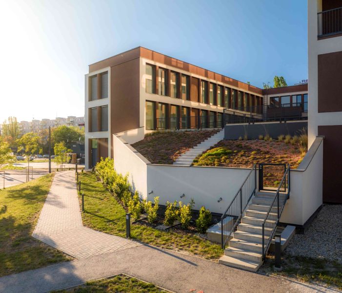 A building with a green roof and staircase on Mierová Street in Bratislava - Ružinov.