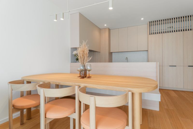 Dining table with chairs in the kitchen, floor with wood decor, 3-room apartment.