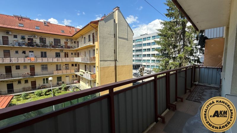 A balcony with a view of the courtyard in Zvolen on Štefánikova Street, 1-bedroom apartment.