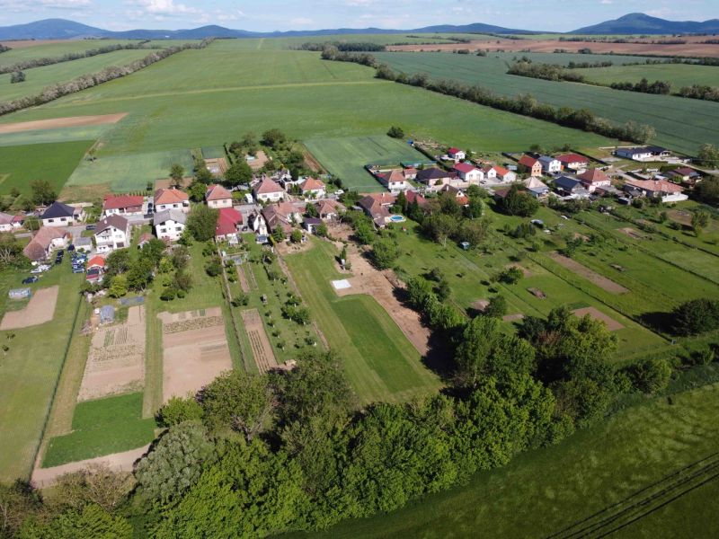 Aerial view of gardens in Hruboňovo with rural landscape and agricultural fields.