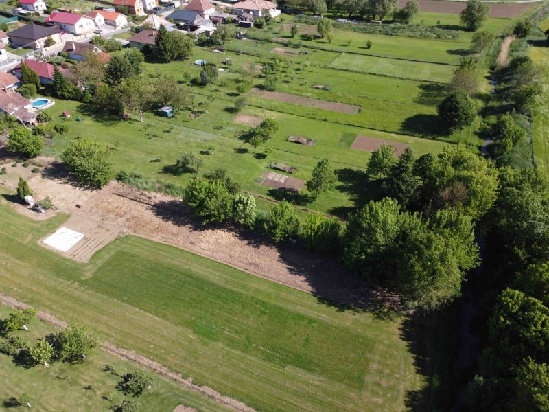 Aerial view of gardens in Hruboňovo with houses and greenery.
