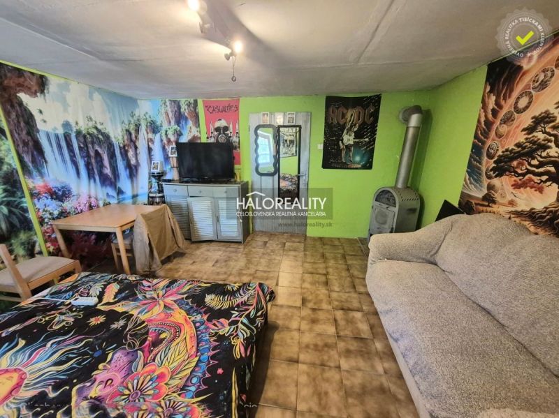 Interior with lively wallpapers, comfortable furniture, and a tiled stove, Gardens.