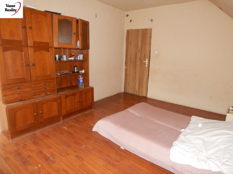 Interior of a family house with wooden furniture and flooring with a wood design.