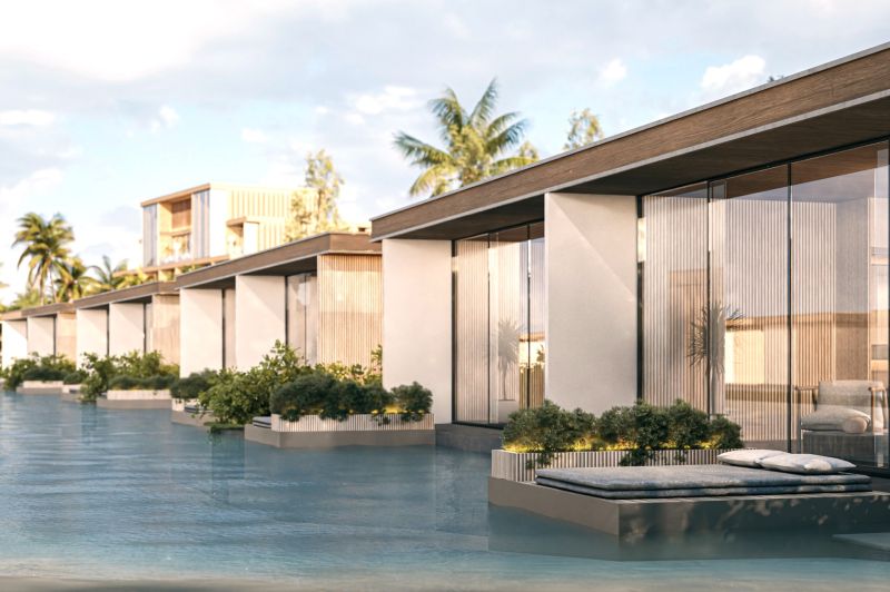 Coastal architecture in Nungwi, 1-bedroom apartment over the water with palm trees in the background.