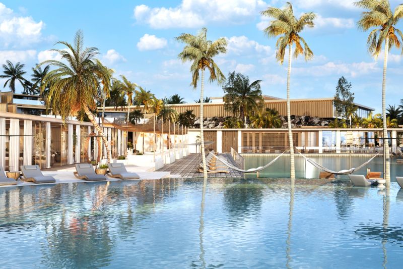 A pool with loungers and palm trees in Nungwi creates a relaxing seaside atmosphere.