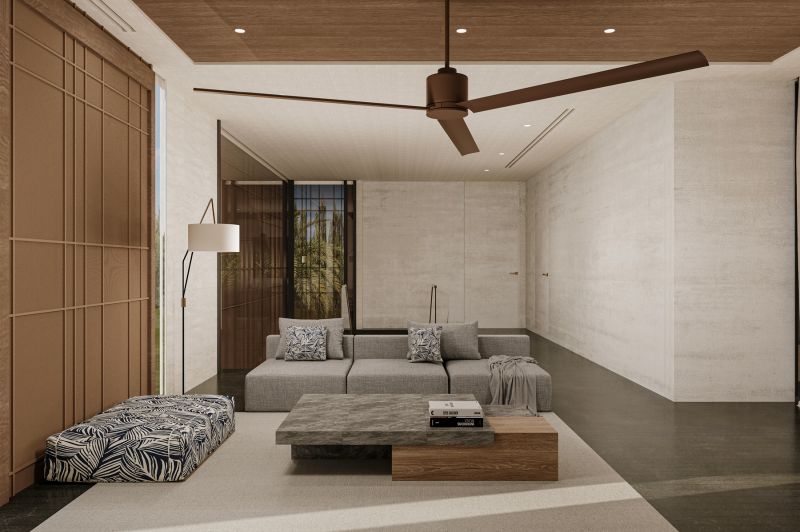 Living room in a villa with a sofa, carpet, and fan; floor with wood decor.