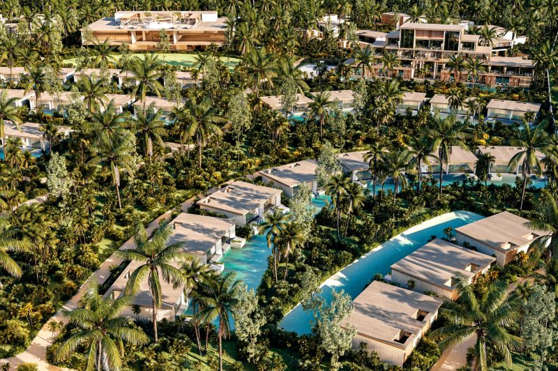 Luxury villas in Nungwi surrounded by palm trees and tropical vegetation.