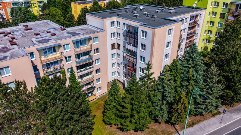 Apartment buildings surrounded by trees on Viestova Street in Myjava.