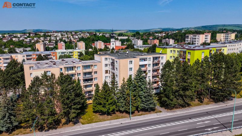 A view of apartment buildings and nature on Viestova Street in the town of Myjava.