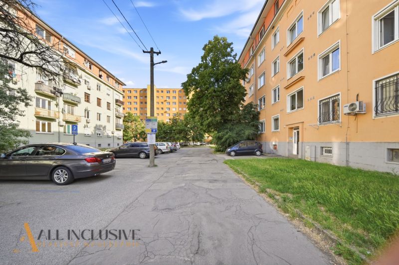 Kukučínova Street in Dunajská Streda with apartment buildings and parked cars, suitable for a 3-room apartment.