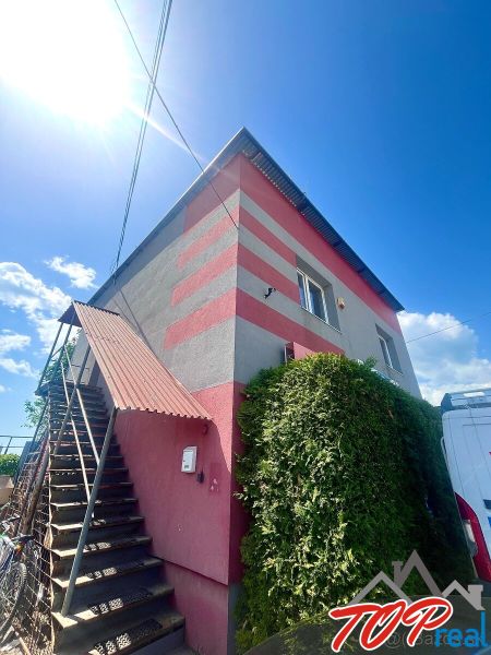 Commercial premises in Košice - Sever district, decorated with colorful stripes, external stairs.