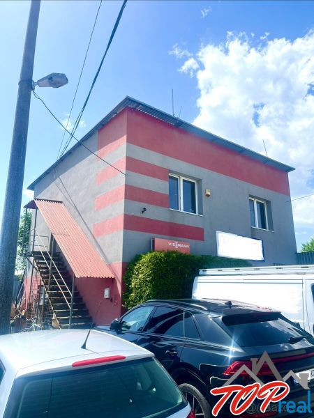 A building with commercial spaces in Košice - Sever district, with parking spaces.