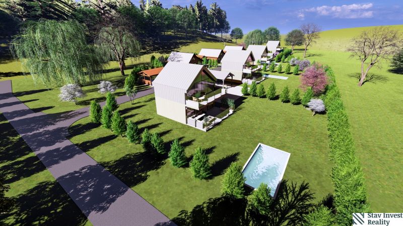 Row houses with gardens on Hlinícka Street in Myjava, surrounded by trees and a swimming pool.
