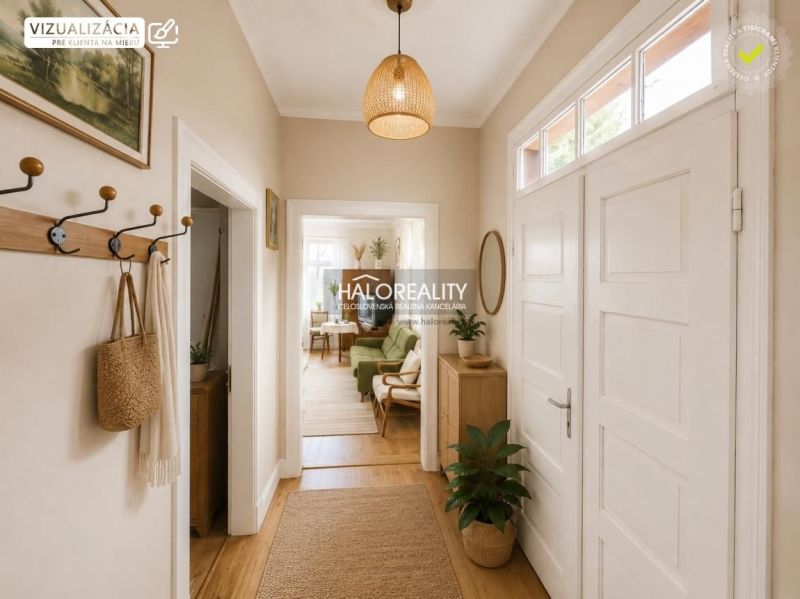 A hallway in a family house with a wooden decor floor and plants, bright atmosphere.