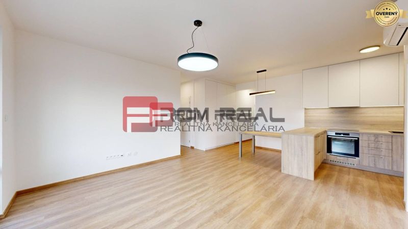 Living room with a kitchen and wooden decor flooring in a 3-room apartment.