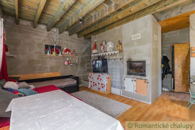 The interior of a cabin with a wooden decor floor and decorations in a natural style.