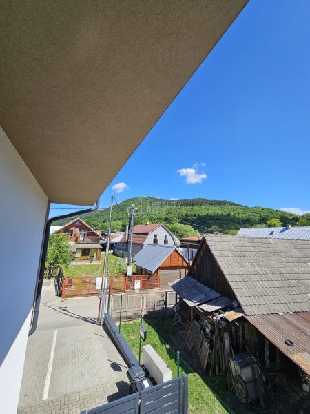 Štiavnik Street in Štiavnik with a view of family houses and green hills.