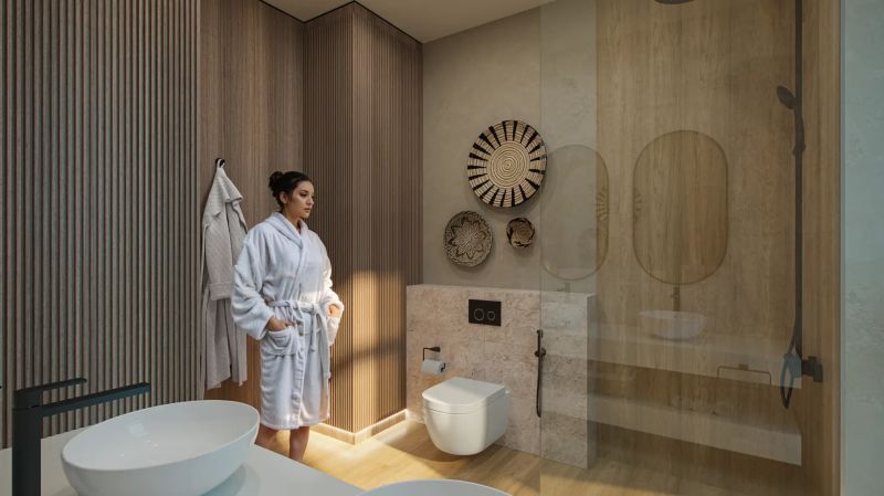 A bathroom with a wooden decor floor and decorative baskets on the wall in a studio apartment.