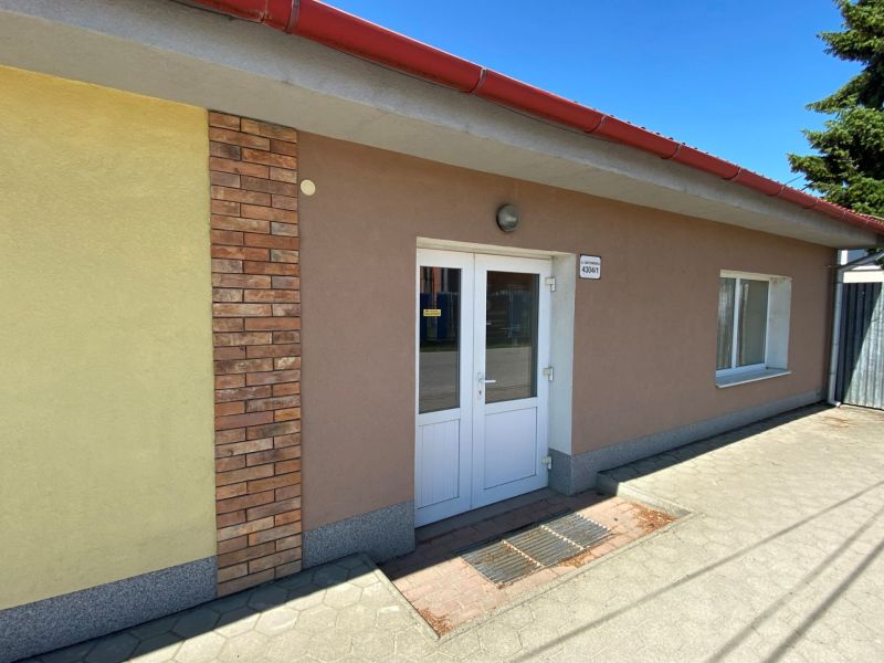 Commercial premises on Cintorínska Street in Rimavská Sobota with brick cladding and a light facade.