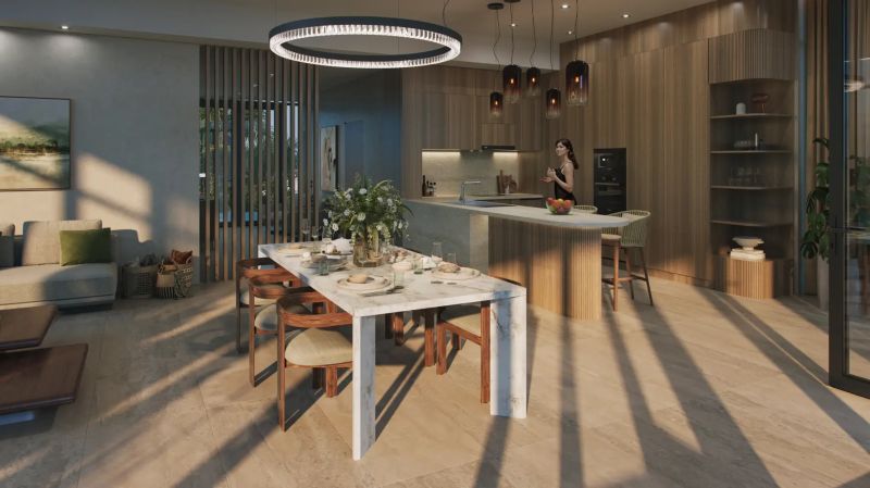 Living room with a dining table and a kitchenette with a wooden decor floor.
