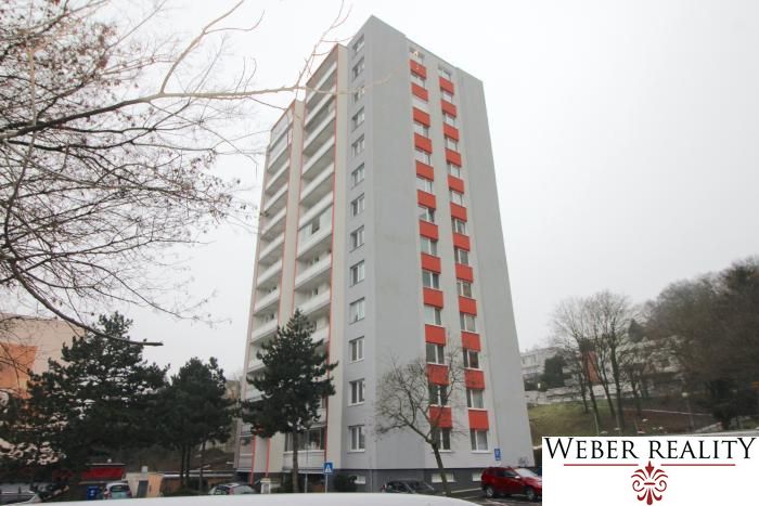 Apartment building with red shutters on Levárska Street, Bratislava - Karlova Ves.