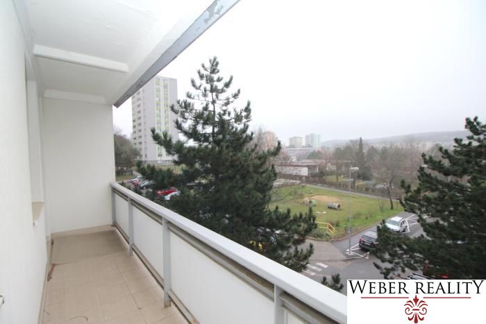 The balcony of a 3-room apartment on Levárska Street in Bratislava - Karlova Ves with a view of greenery.