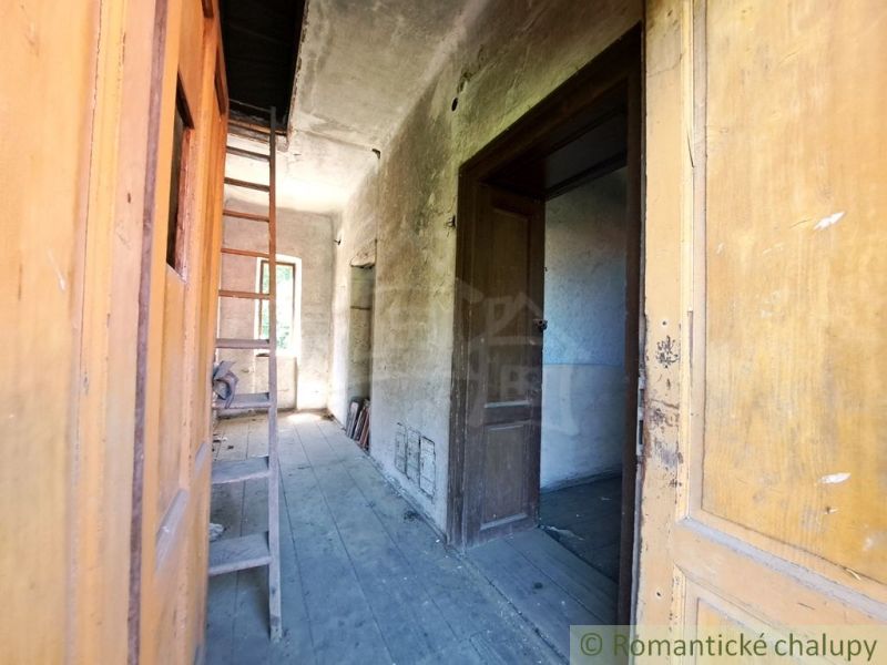 The interior of a family house with wooden doors and a floor with a wooden decor.