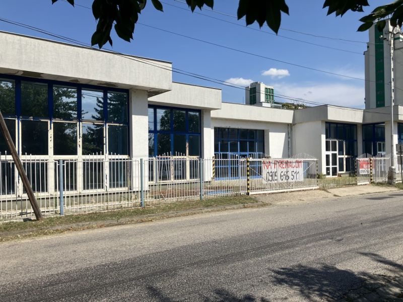 A building with blue windows on 1. Mája Street in Hurbanovo, Warehouses and Halls.
