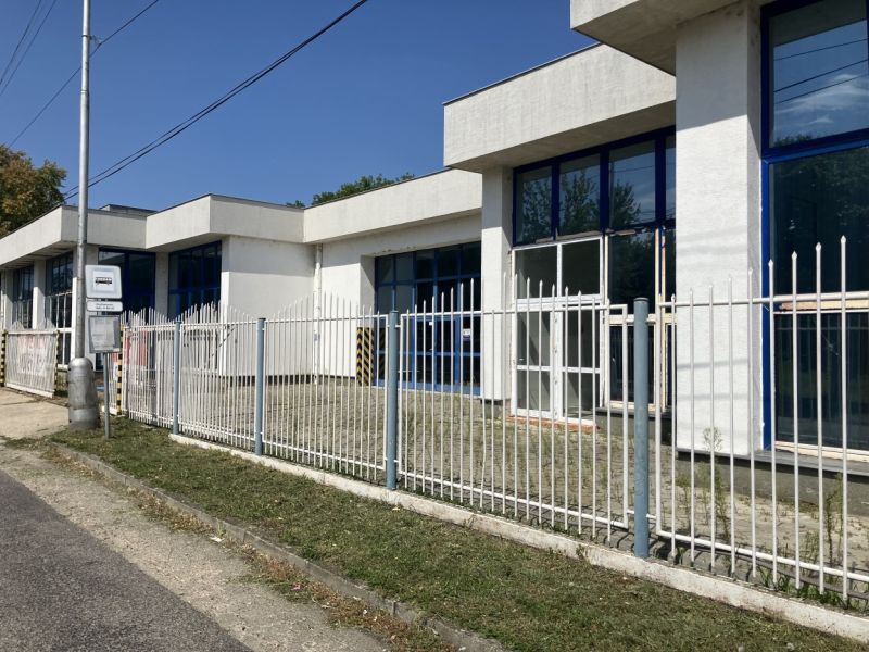 Commercial premises on 1st May Street, Hurbanovo, with large glass windows and a fence.