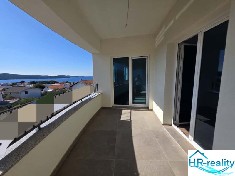 Terrace of a 2-room apartment in Žaborić with a sea view and tiling.