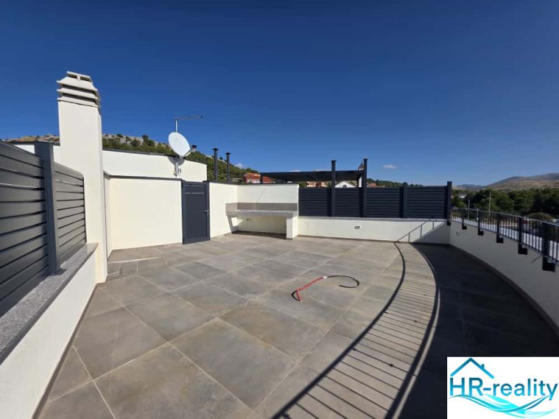 A surface terrace with tiles and a view in the Žaborič environment from a 2-room apartment.