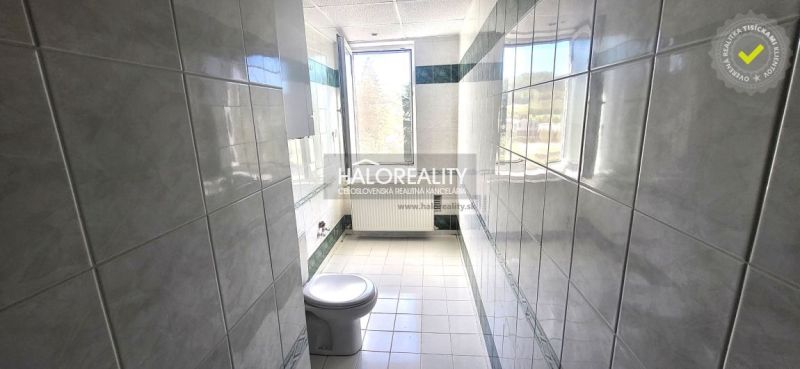 Bathroom with a toilet and a large window in a 3-room apartment.