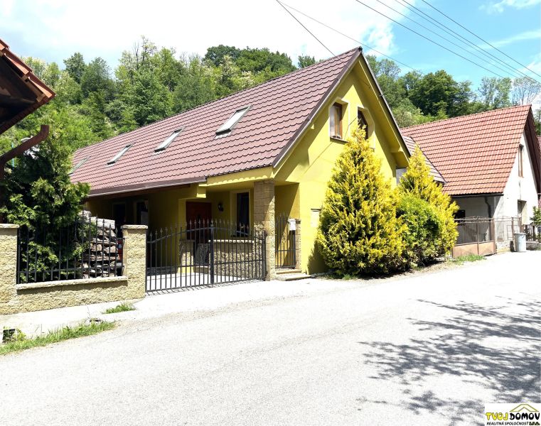 A family house in Bartošova Lehôtka with two floors and a garden, surrounded by greenery.